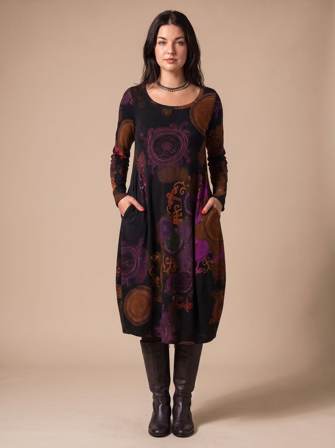 Vestido midi de manga larga combinado con botas altas, look otoñal