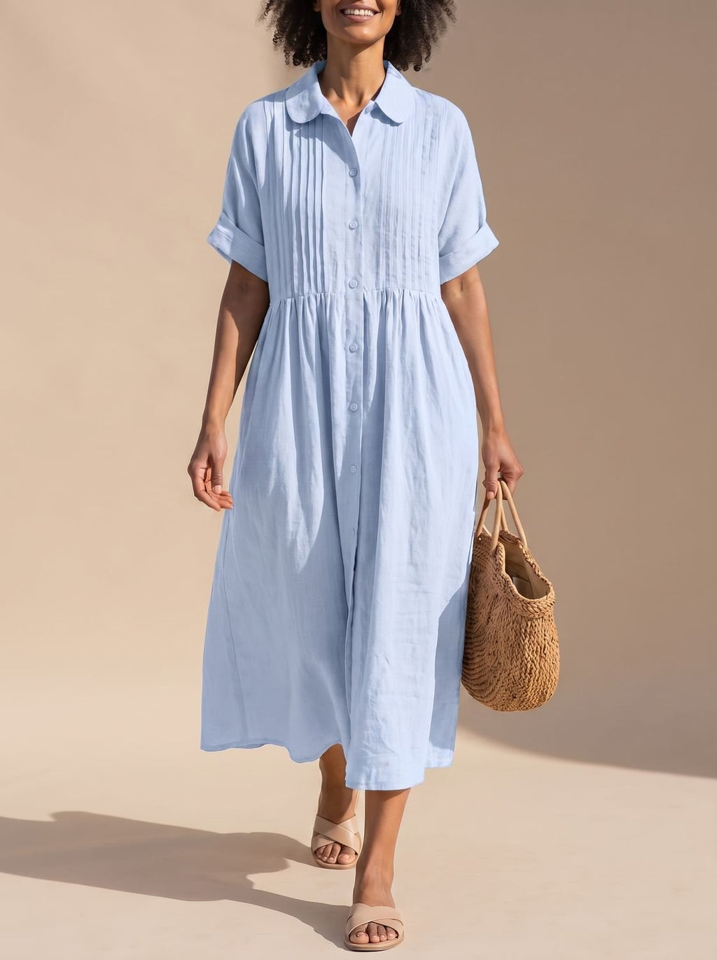 Detalle de los botones frontales del vestido camisero midi de algodón