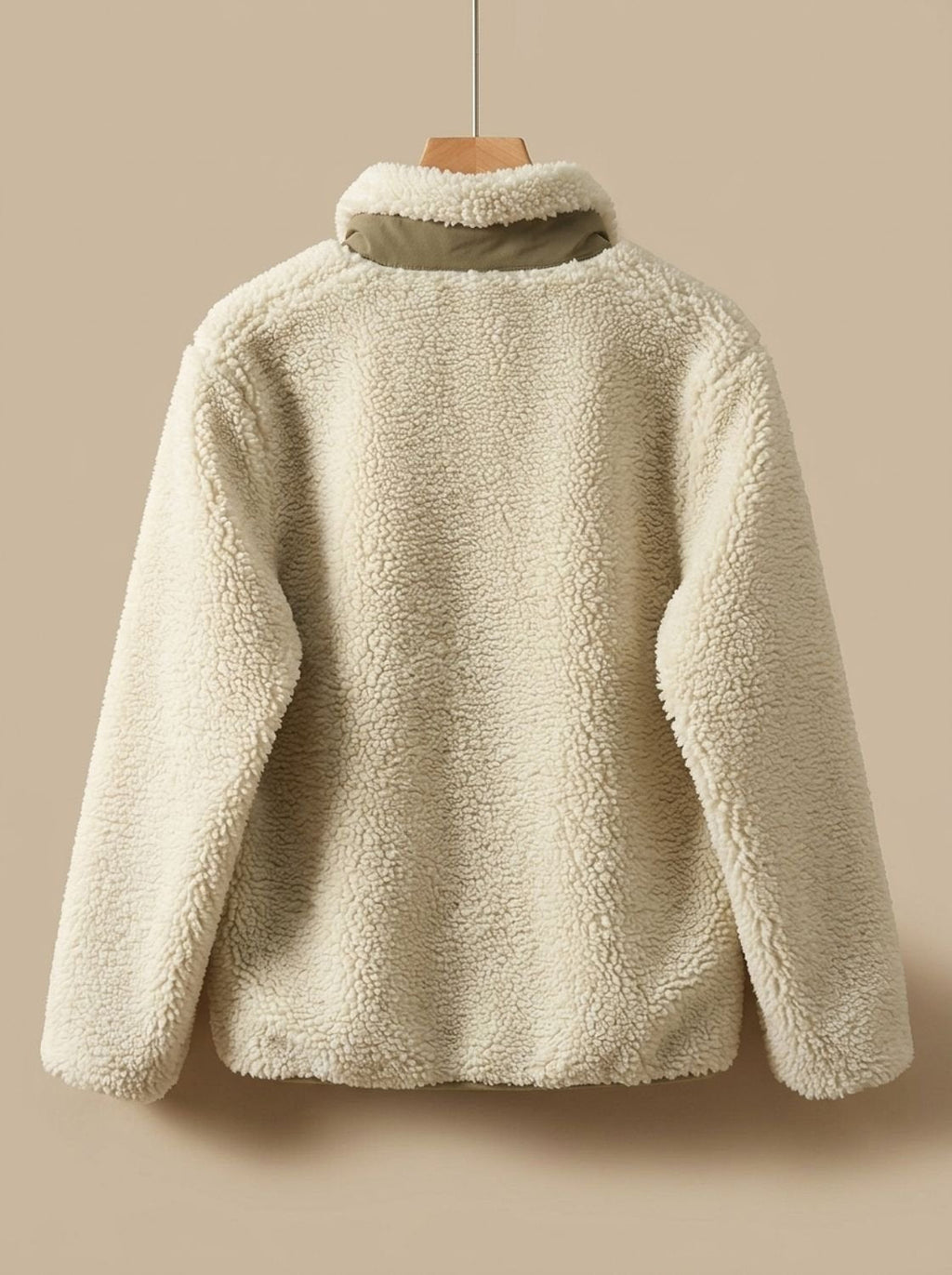 Textura suave y mullida del tejido sherpa de la chaqueta